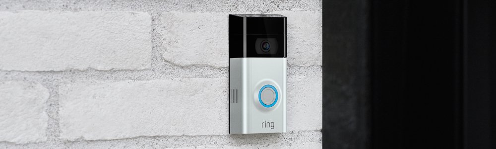 A Ring Video Doorbell mounted on a brick wall